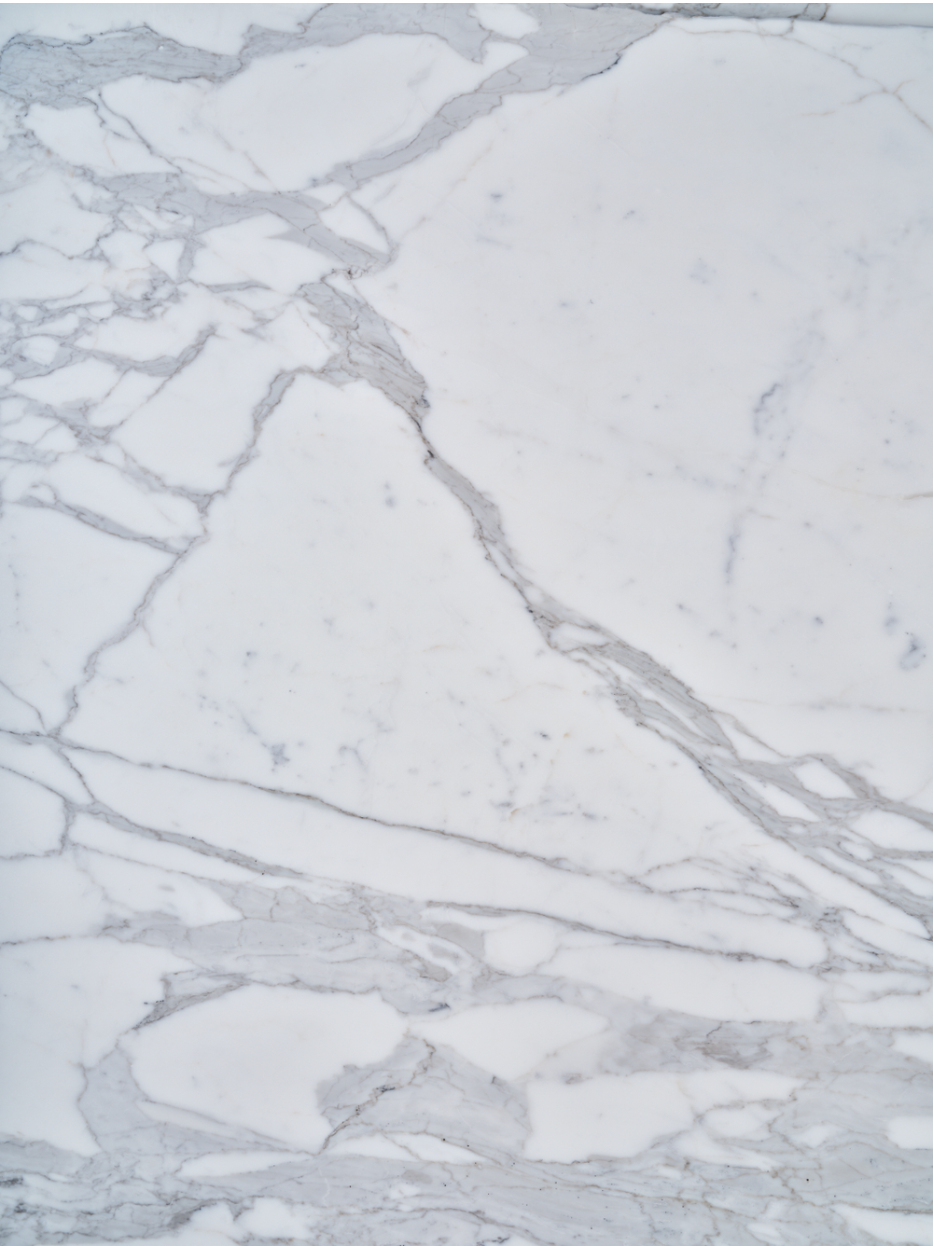 Calacatta Extra vinyl backdrop. Vinyl image is of white and grey stone backdrop perfect for food, drink, and product photography.