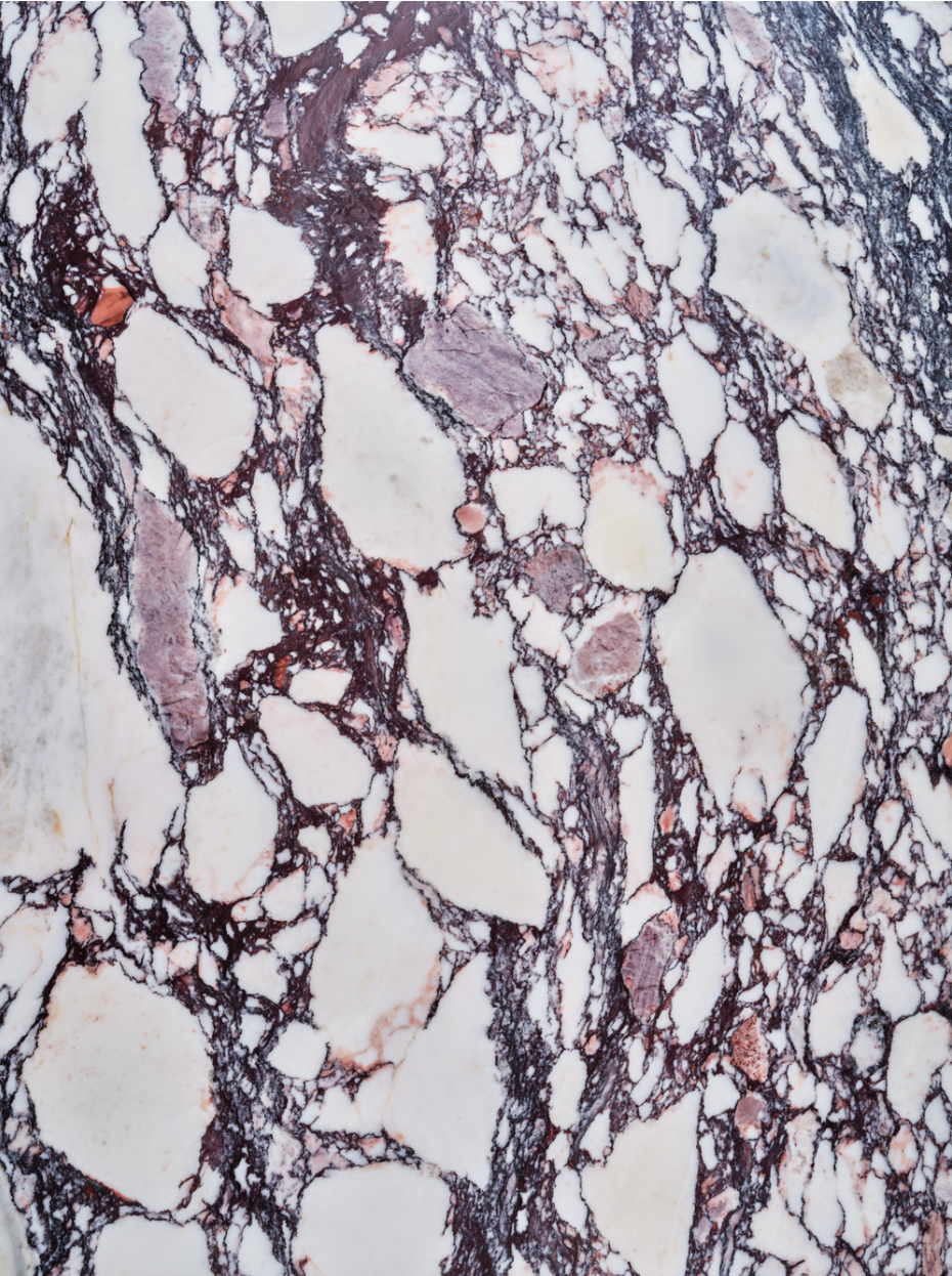 Calacatta Viola vinyl backdrop. Vinyl image is of fragmented warm grays and whites with deep red streaks on marbled stone.