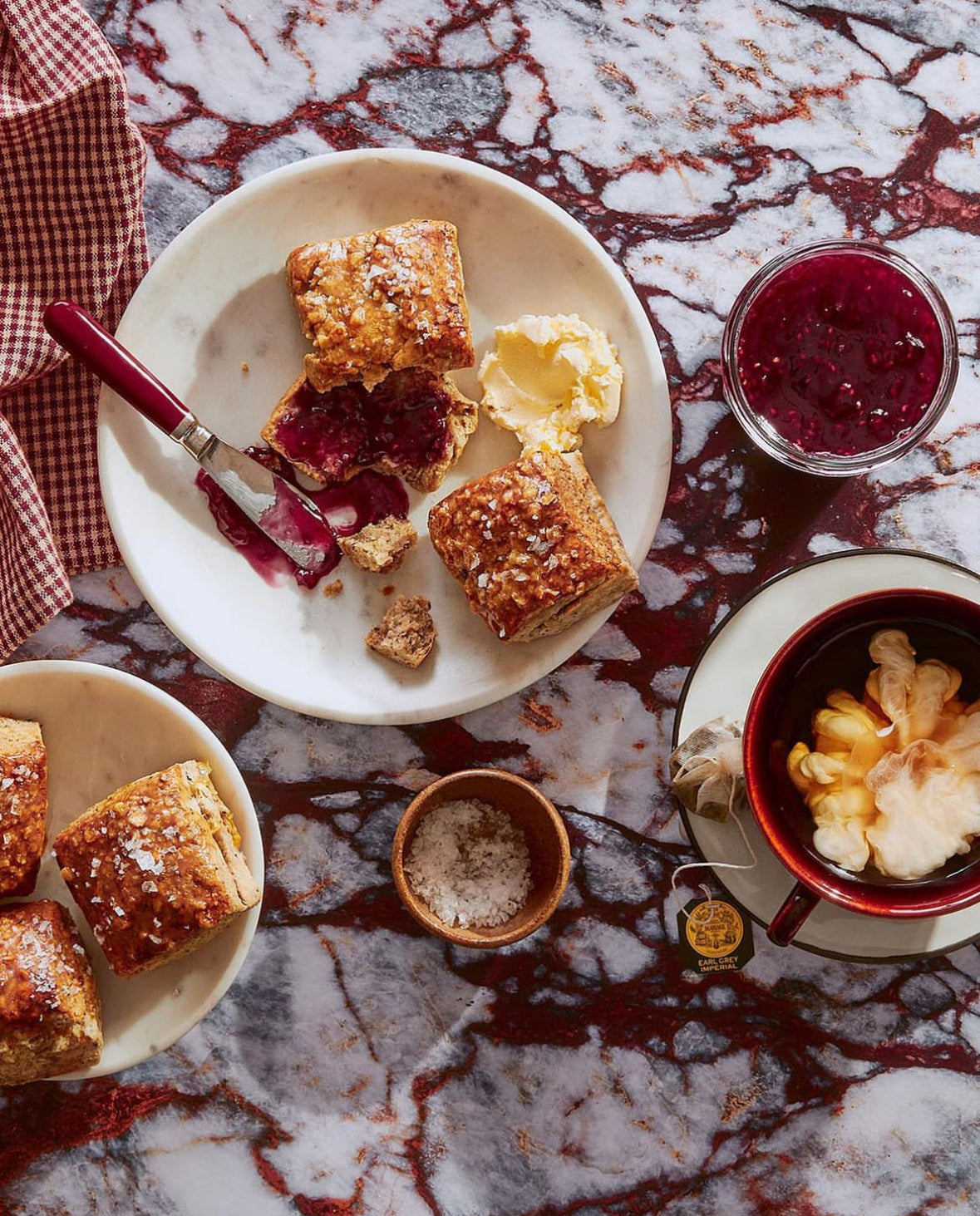 Calacatta Granviola vinyl backdrop. Vinyl image is of deep red, brown, and grey stone surface perfect for food, drink, and product photography.