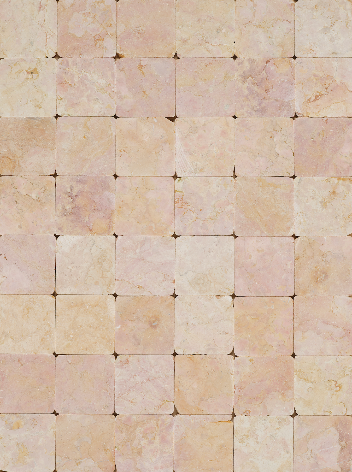 warm beige pearlescent square tile backdrop