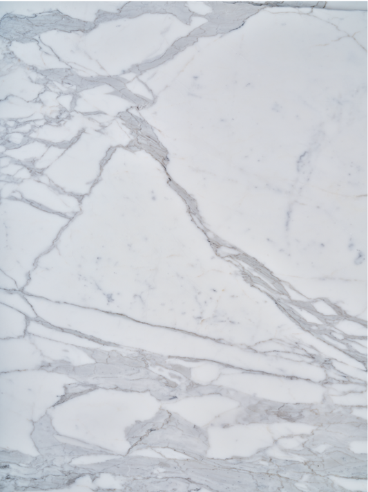 Calacatta Extra vinyl backdrop. Vinyl image is of white and grey stone backdrop perfect for food, drink, and product photography.