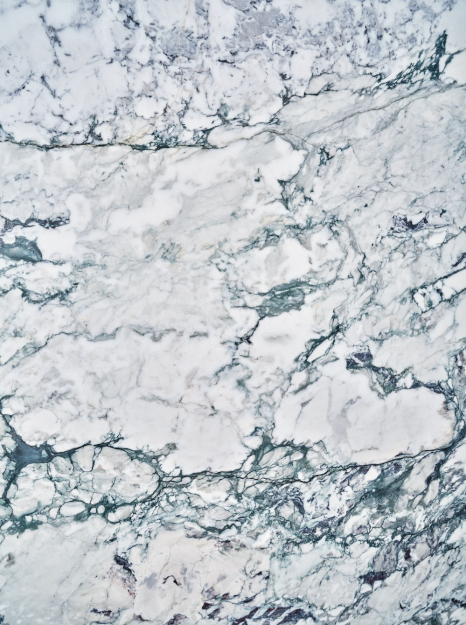 Calacatta Turquoise vinyl backdrop. Vinyl image is of cool toned blue, gray, and white marbled stone surface.