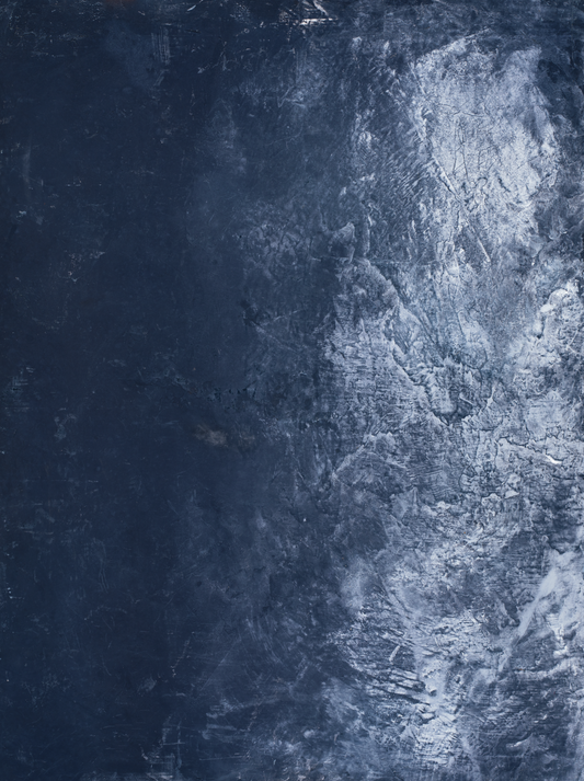 Dark and Stormy vinyl backdrop. Vinyl image is of a deep blue textured plaster surface with strokes of steel gray and a cool toned white