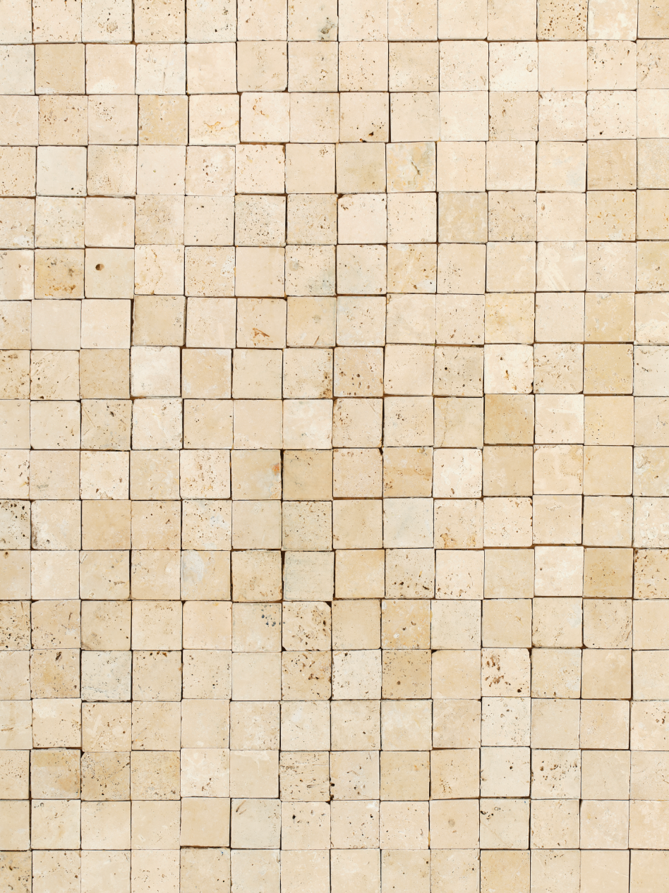 vinyl backdrop of cream colored pearlescent square tile with no grout surface