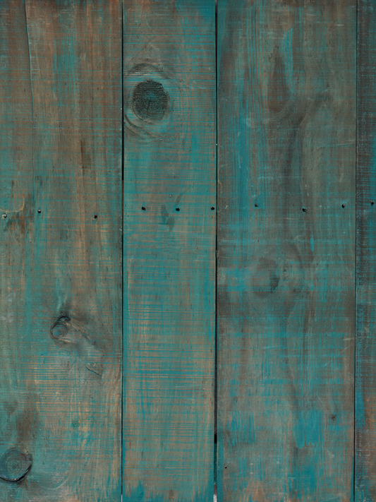 grey wood surface with faded blue paint