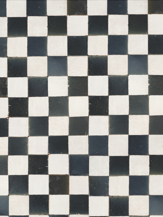 black and white scuffed tile arranged in checkered pattern, no grout