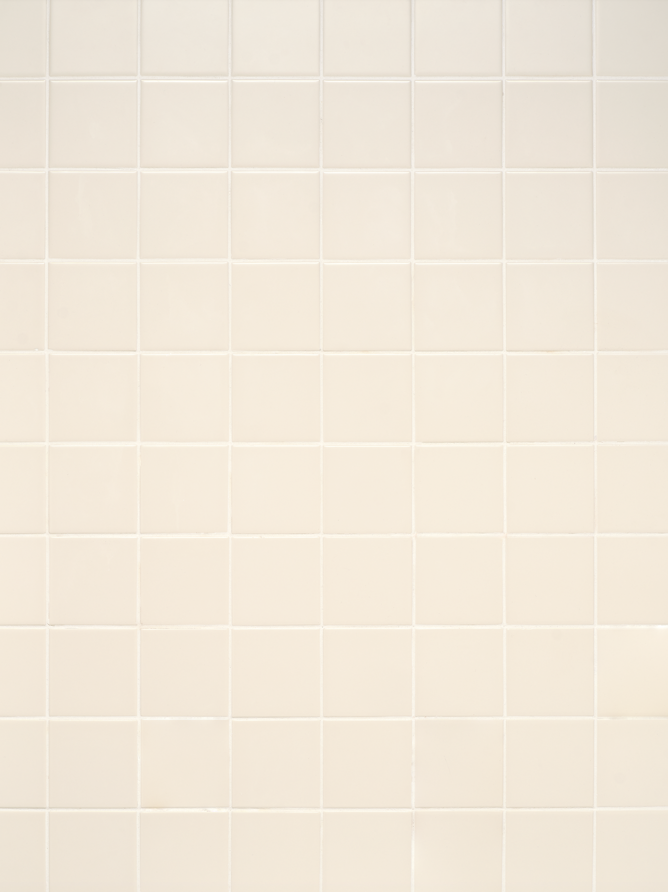 warm white toned square tiles surface with neutral white grout
